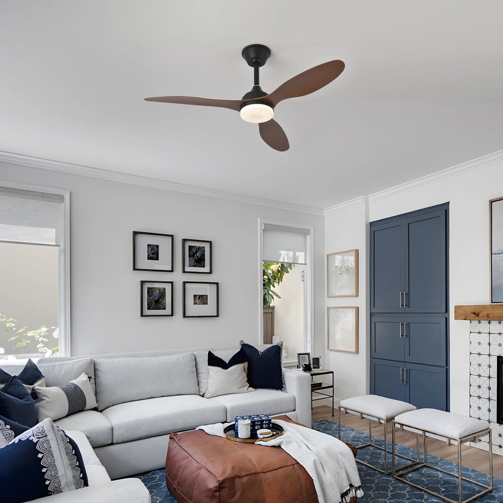Low-profile ceiling fan with light and remote control featuring black metal and three dark brown wooden blades with frosted glass fixture
