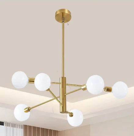 Gold-toned nordic modern sputnik semi-flush mount chandelier with six frosted glass globe bulbs