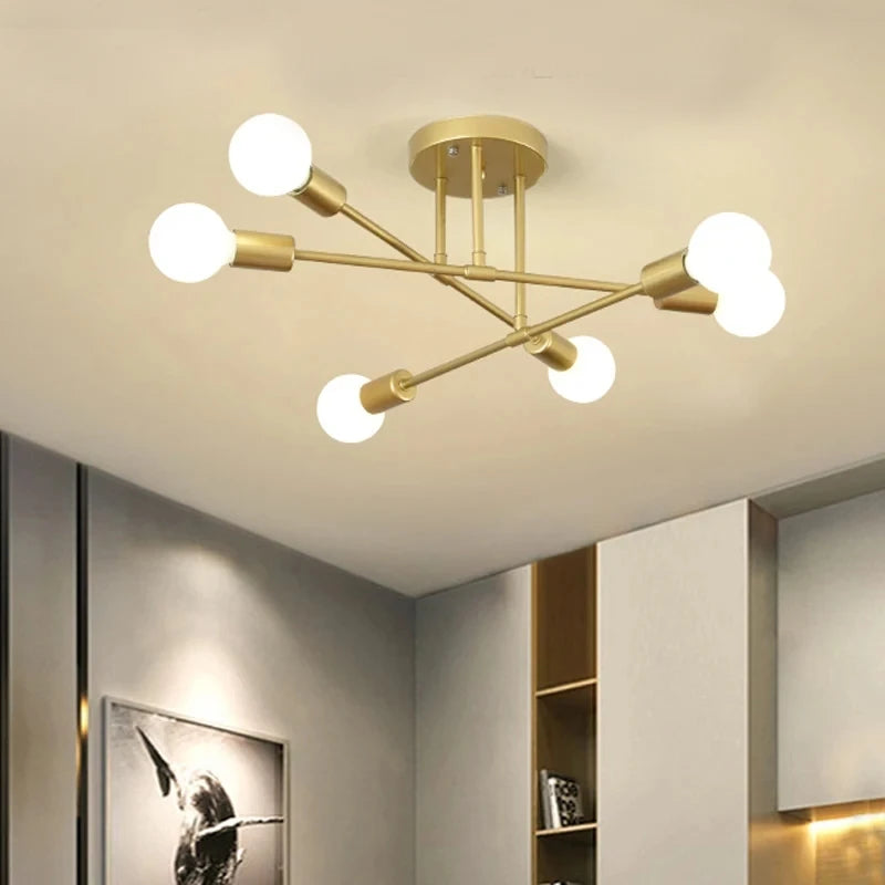 Gold-toned modern nordic sputnik led chandelier ceiling light with six spherical bulbs in a symmetrical branching design